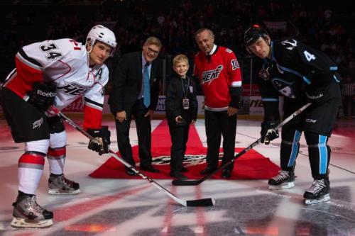 Opening face-off featuring Guy Lafleur, Ryan Walter, Carter Bancks #34 of the Abbotsford Heat and Scott Ford #4 of the Milwaukee Admirals before the AHL game featuring the Abbotsford Heat against the Milwaukee Admirals at the Abbotsford Entertainment & Sports Centre on October 11, 2013 in Abbotsford, British Columbia, Canada.  (Photo by Clint Trahan/Abbotsford Heat)