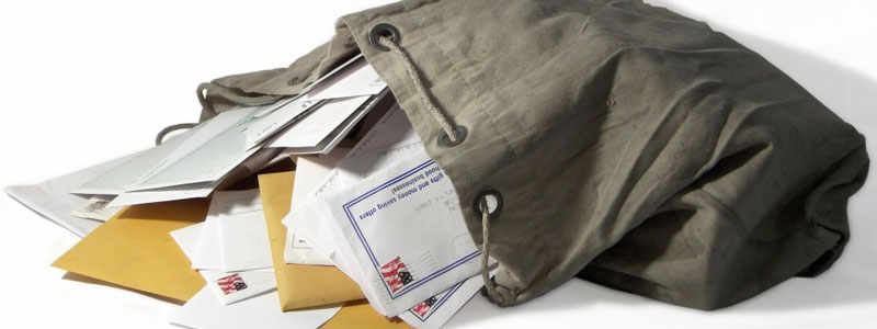 Cliche photo of mail spilling out of a bag for a mail bag column. (Photo Credit: Google Image Search)